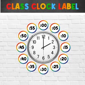 May include: A classroom clock with a white face and black hands, surrounded by colorful circles with numbers representing minutes. The circles are arranged in a circle around the clock, with the numbers increasing clockwise. The clock face has black numbers and a black minute hand and hour hand. The clock is labeled "CLASS CLOCK LABEL".