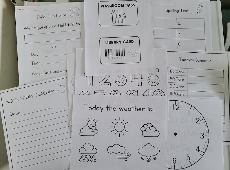 May include: Black and white printable worksheets for kids. The worksheets include a field trip form, a library card, a washroom pass, a spelling test, a schedule, a clock, and a weather chart.