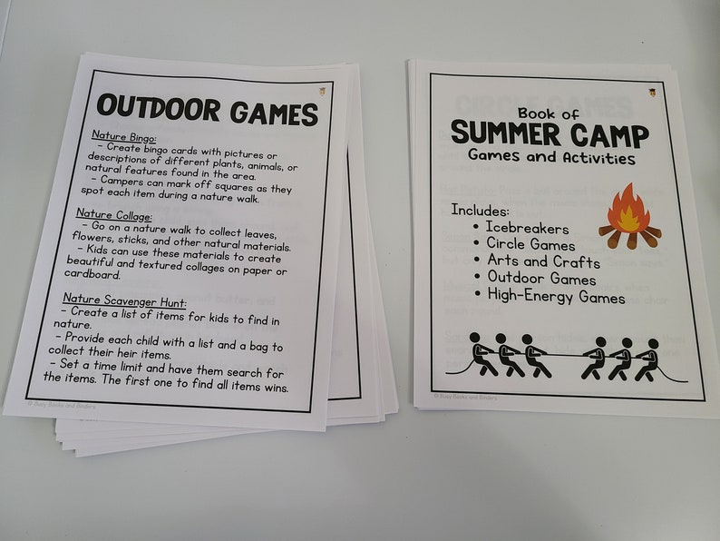 May include: Two pages of a summer camp activity book. The left page lists outdoor games for kids, including Nature Bingo, Nature Collage, and Nature Scavenger Hunt. The right page lists the different types of games and activities included in the book, such as icebreakers, circle games, arts and crafts, outdoor games, and high-energy games. The page also features a campfire and a group of people playing tug-of-war.