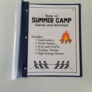 May include: A blue binder with a white page showing a list of summer camp games and activities. The page includes the text "Book of Summer Camp Games and Activities" and a list of activities including "Icebreakers", "Circle Games", "Arts and Crafts", "Outdoor Games", and "High-Energy Games".