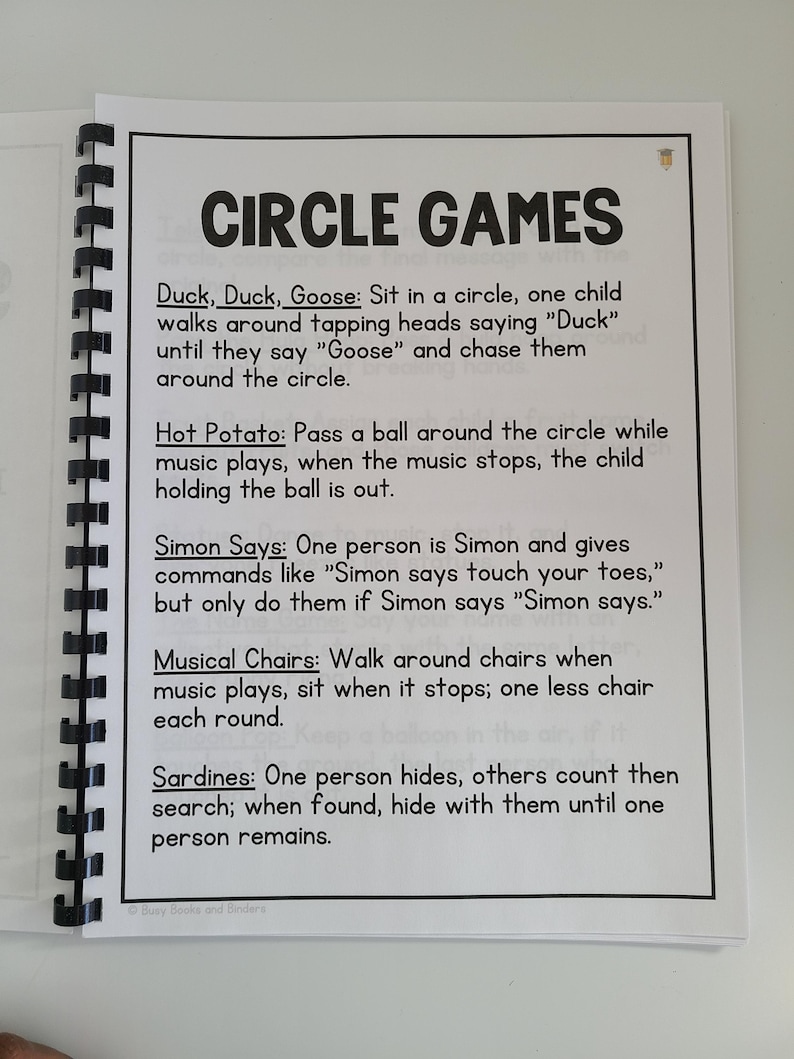 May include: A page from a book with the title "Circle Games" and a list of four circle games: Duck, Duck, Goose, Hot Potato, Simon Says, and Musical Chairs. Each game is described with instructions on how to play.