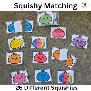May include: A Squishy Matching educational game set featuring rectangular cards with illustrations of colorful, smiling, round characters. The cards show various solid colors, patterns, and rainbow gradients. Some cards are split into two pieces.