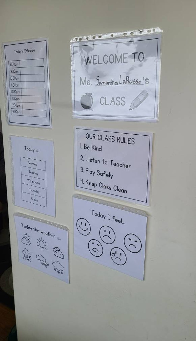 May include: A classroom wall with a schedule, a welcome sign, class rules, and a weather and mood chart. The welcome sign says "Welcome to Ms. Samantha LaRusso's Class". The class rules are: Be Kind, Listen to Teacher, Play Safely, and Keep Class Clean.