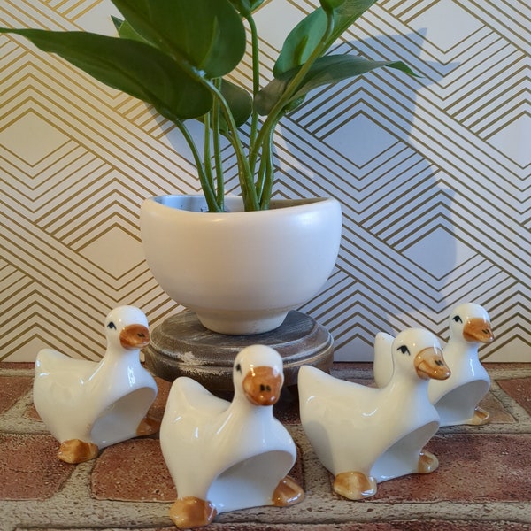 Set of (4) vintage ceramic duck napkin rings