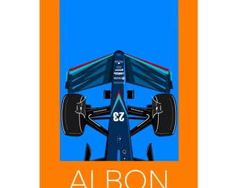 May include: A blue and white Formula 1 race car with the number 23 on the side. The car is viewed from above, with the front of the car facing the viewer. The car is on a blue background with the word "ALBON" in white letters below the car.