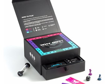 May include: A black box game called "Why Not?" with a colorful game board inside. The box has a drawer with a level 1 card and an hourglass. There are also colorful game cards and game pieces.