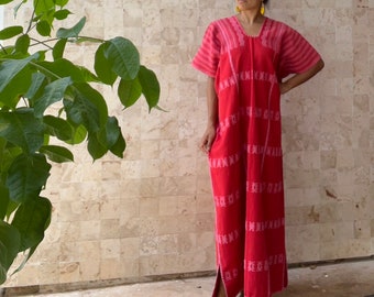 May include: A red and pink embroidered maxi dress with a V-neck and short sleeves.
