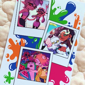 May include: A rectangular art print featuring three polaroid-style illustrations of animated characters with colorful ink splatters in green, blue, orange, and pink. The bottom of the print displays the text bunnalien.etsy.com in white.