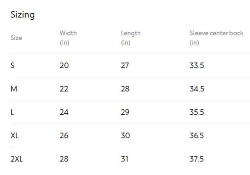 May include: A white table of clothing sizes, including width, length, and sleeve center back measurements in inches. Sizes range from S to 2XL, with corresponding measurements for each size. The table is labeled "Sizing".