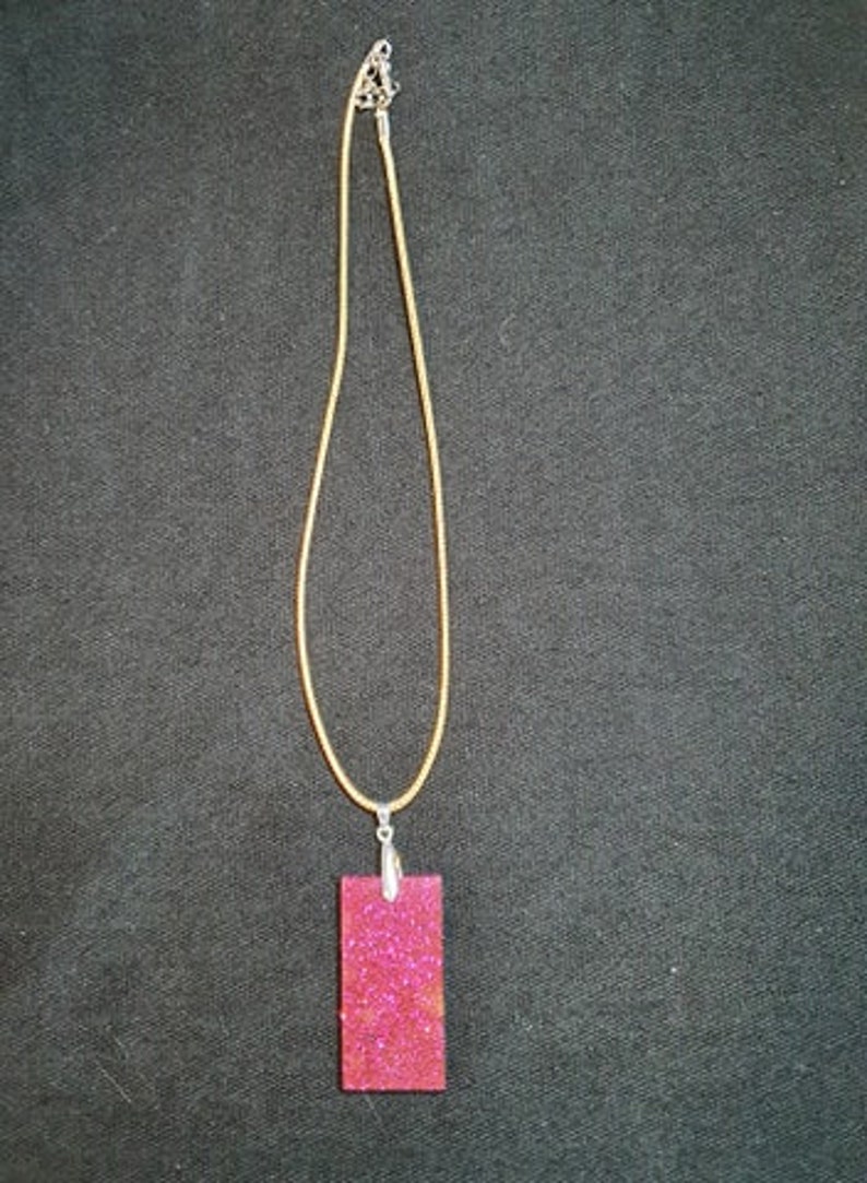 Purplepink glitter pendant with cord necklace