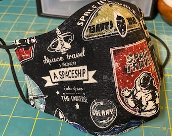 Space Travel-Handmade face mask with space travel badges and galactic insignia. Black. Made in the USA.