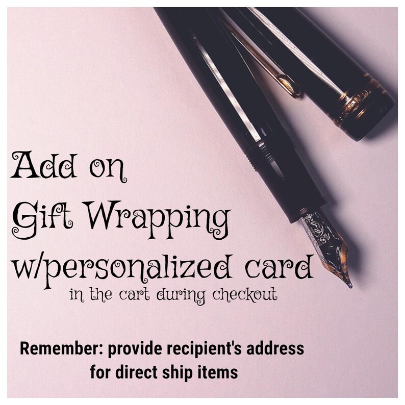 May include: A black fountain pen with a silver nib and cap rests on a light pink background. The text reads: Add on Gift Wrapping w/personalized card in the cart during checkout. Remember: provide recipient's address for direct ship items.