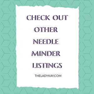 May include: A rectangular white sign with torn edges set against a mint green background featuring a repeating geometric pattern. The text in dark purple reads: CHECK OUT OTHER NEEDLE MINDER LISTINGS. Below this, the text THELADYKAY.COM is printed.