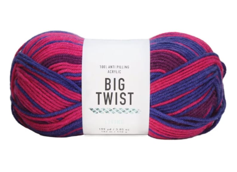 May include: A skein of Big Twist yarn in the "Spring" colorway. The yarn is a blend of pink and purple stripes. The label reads "100% Anti-Pilling Acrylic, Big Twist, Spring, 198 yd / 3.05 oz, 182 m / 110 g."