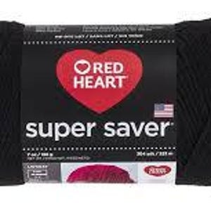 May include: A skein of solid black Red Heart Super Saver yarn with a central paper label featuring a red heart logo, the text 'super saver', a small American flag icon, and printed weight specifications of 7 oz and 198 g for this craft supply.