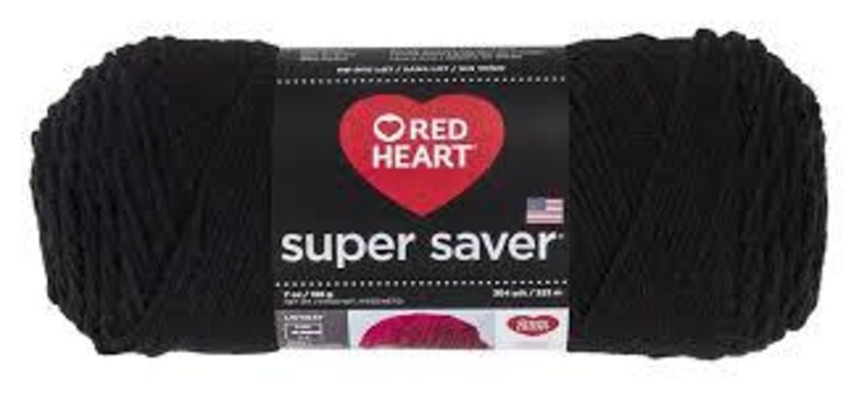 May include: A skein of solid black Red Heart Super Saver yarn with a central paper label featuring a red heart logo, the text 'super saver', a small American flag icon, and printed weight specifications of 7 oz and 198 g for this craft supply.