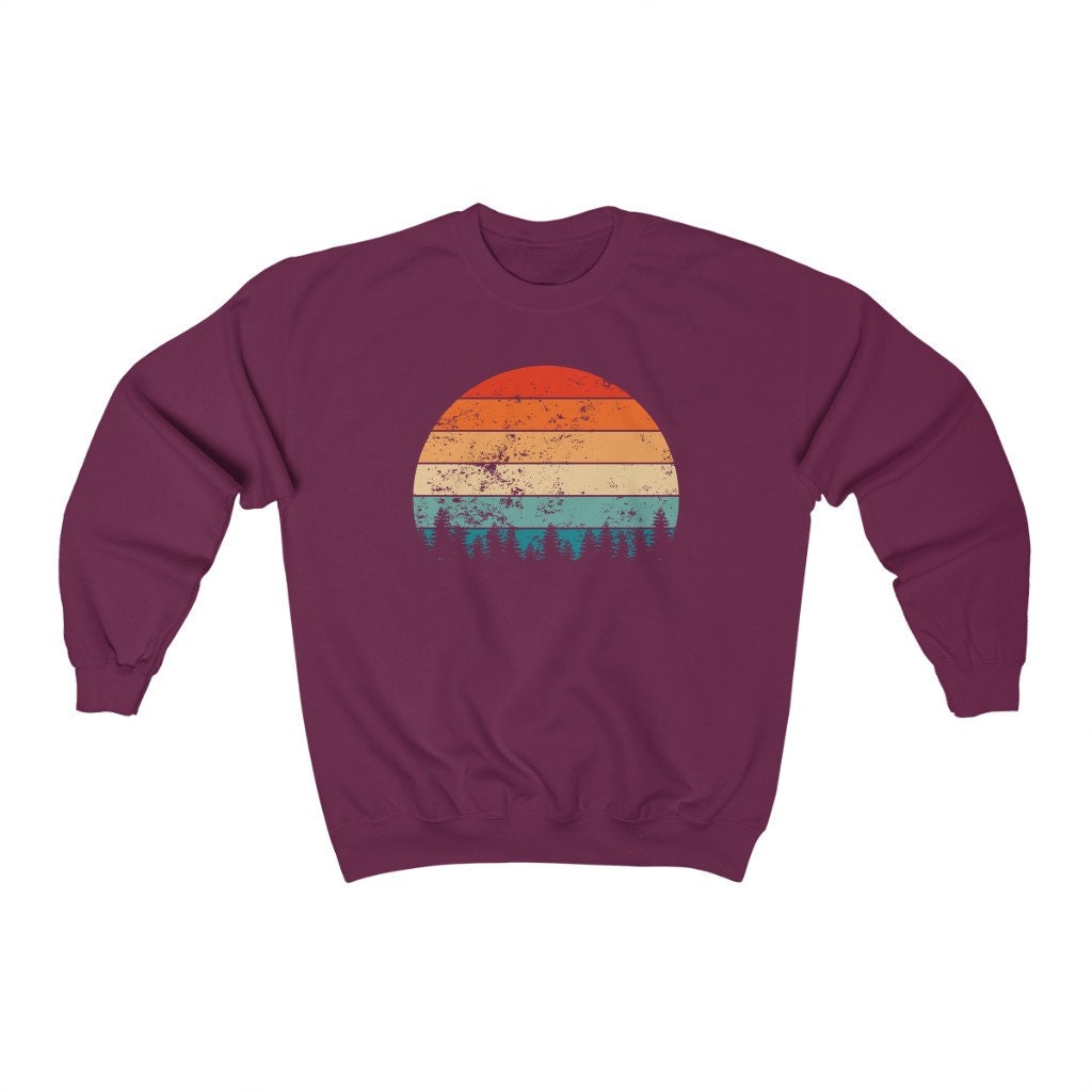 purple sweatshirt with sun