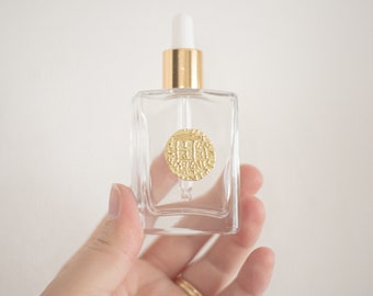 Frasco de sérum con gotero en forma de moneda dorada para aceites esenciales y belleza, 30 ml