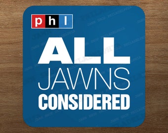 May include: Square blue coaster with the text "ALL JAWNS CONSIDERED" in white. The word "phl" is in a red, black, and white box in the upper left corner. The background is a wooden surface.