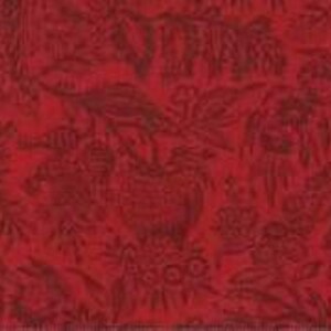 May include: Close-up of a red fabric with a dark red floral pattern. The design features a vase with flowers and foliage, along with other floral elements. The fabric has a textured appearance.