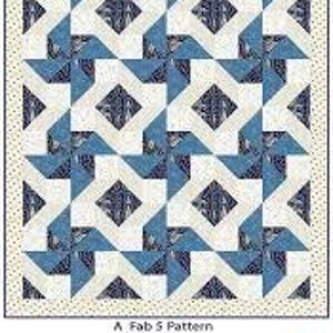 May include: A quilted textile with a "windmills" pattern. The quilt features a repeating design of blue and white geometric shapes, including diamonds and triangles. The quilt measures 54 x 70 inches and has a dotted border. The text "The Quilt Factory" is at the bottom.