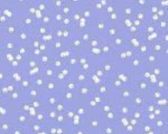 May include: A light blue fabric with a white pattern of small circles and squares containing letters.