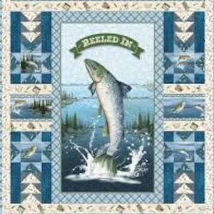 May include: A rectangular fabric quilt panel featuring a central illustration of a leaping fish over water with the text REELED IN. The border displays a repeating pattern of fish, pine trees, and geometric blue and cream star motifs.