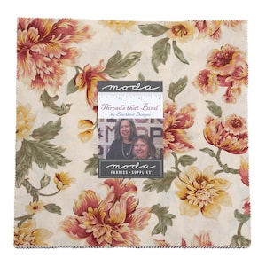 May include: A square fabric piece with a floral pattern in shades of cream, yellow, and burgundy. The fabric features large, stylized flowers and green leaves. A label reads "Threads that Bind" by Blackbird Designs and "Moda Fabrics + Supplies."