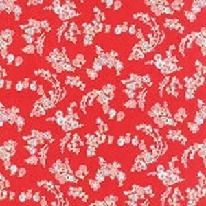 Könnte beinhalten: Roter Stoff mit einem weißen Blumenmuster. Das Muster zeigt kleine, stilisierte Blumen und Blätter.