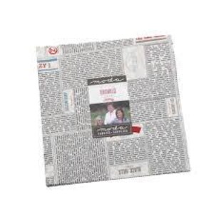 May include: A square fabric piece with a newspaper print background and a central label. The label features a photo of two people and the text "MODA" and "SHREDS". The fabric appears to be a quilting cotton.