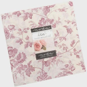 May include: A square fabric piece with a floral pattern in shades of pink and cream. The design features roses and foliage. The fabric is labeled "moda" and "3 Sisters Favorites Lavender Fields."