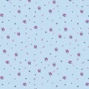 May include: A light blue fabric with a repeating pattern of small pink flowers and tiny blue dots. The flowers have green stems and leaves. The overall design is delicate and floral.