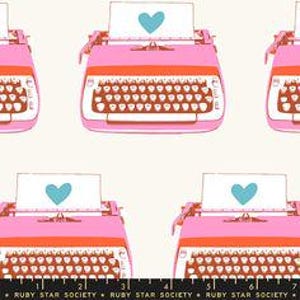 May include: A white background with a repeating pattern of pink typewriters with blue hearts on the paper. The typewriters have orange and brown keys.