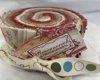 May include: A roll of fabric with a white, gray, and red striped pattern. The fabric is tied with a white ribbon with brown and blue polka dots. The label reads "Rouenneries by French General".