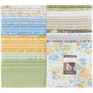 May include: A collection of fabric squares in various patterns and colors, including blue, yellow, green, and white. The fabrics feature floral, geometric, and striped designs. A label with a person's image is visible on one stack.