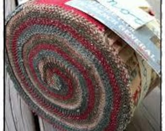 May include: A roll of fabric with a red, brown, and blue striped pattern. The fabric is rolled up and tied with a white ribbon. A tag is attached to the ribbon that says "Moda - American General".