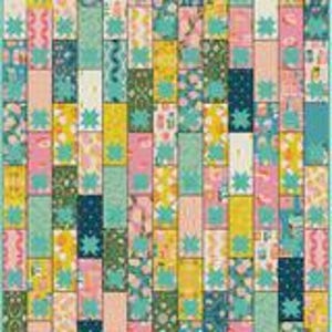 May include: A quilt featuring a vertical brick-like pattern of rectangular fabric strips in various colors including pink, yellow, dark blue, and green. Each rectangular section is accented with a small, teal, four-pointed star shape.