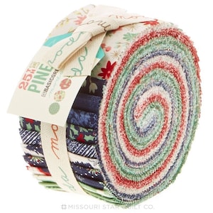 May include: A roll of 25 fabric squares with a Christmas theme. The fabric squares are in various shades of red, green, blue, and white. The roll is tied with a white ribbon and has a label that says "25th Hand Pine Basicgre Morea".
