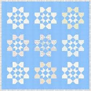 May include: A light blue quilt with a repeating pattern of nine star-like designs. Each design features a white and light-colored patchwork pattern. The quilt has a light blue border.