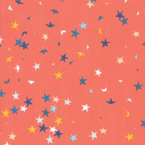May include: A coral pink fabric with a repeating pattern of white, blue, and yellow stars. The stars are of various sizes and are scattered randomly across the fabric.