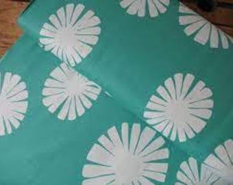 May include: Teal fabric with a white repeating pattern of stylised sunbursts.