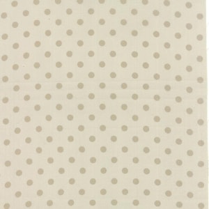 May include: Cream-colored fabric with a repeating pattern of evenly spaced, light brown polka dots. The dots are circular and of a consistent size, creating a simple, yet visually appealing design. The fabric appears to be a cotton or linen blend.