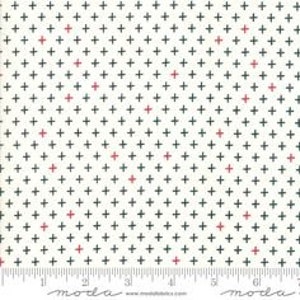 May include: White fabric with a repeating pattern of small black and red plus signs.