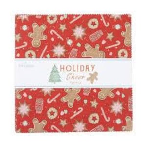 May include: A bundle of red fabric squares featuring a Christmas-themed pattern. The design incorporates gingerbread men, candy canes, and stars. A white band across the centre displays the text "HOLIDAY Cheer" with a Christmas tree and gingerbread man illustration.
