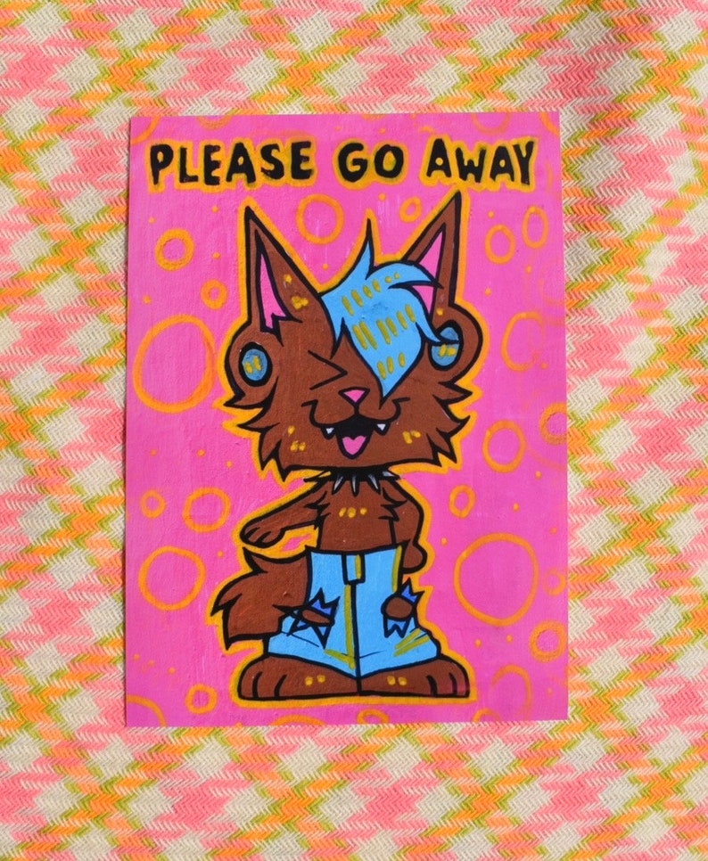 May include: A cartoon illustration of a brown and blue wolf with a pink background and the text "PLEASE GO AWAY". The wolf is wearing blue jeans with gold accents and has a black collar with spikes.