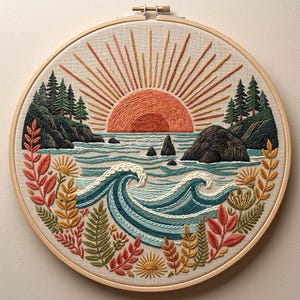 May include: A circular embroidery hoop containing a fabric panel with a hand-stitched landscape. The design features a large orange sun rising over a blue ocean with rocky cliffs, evergreen trees, and stylized foliage in shades of red and gold.