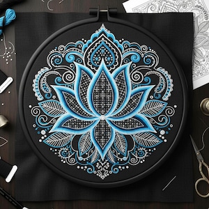 May include: A completed cross-stitch embroidery project featuring a detailed blue and white lotus flower design on black fabric, set in a black embroidery hoop. The design includes intricate patterns and shading, showcasing a floral theme.