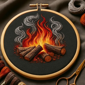 May include: Embroidered campfire design in a wooden hoop. The image shows a detailed fire with orange and red flames, brown logs, and grey smoke against a black fabric. The craft theme is enhanced by the wooden hoop and threads.