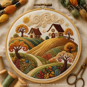 May include: A detailed embroidery hoop art piece featuring a rural landscape with rolling hills, trees, and two houses. The artwork uses various shades of green, yellow, and brown thread. The text "HAND EMBROIDERY PATTERNS BY ZAZARITA" is at the bottom.