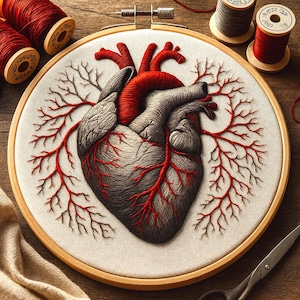 May include: Anatomy-themed embroidery art featuring a detailed human heart in red and gray thread. The heart is centered within a wooden embroidery hoop, with red veins extending outwards. Spools of red and gray thread are arranged around the hoop.